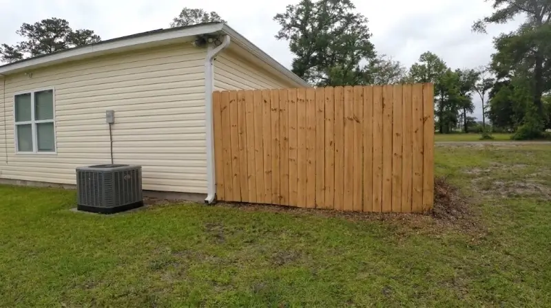 Wood fence after a soft wash cleaning near Plant City